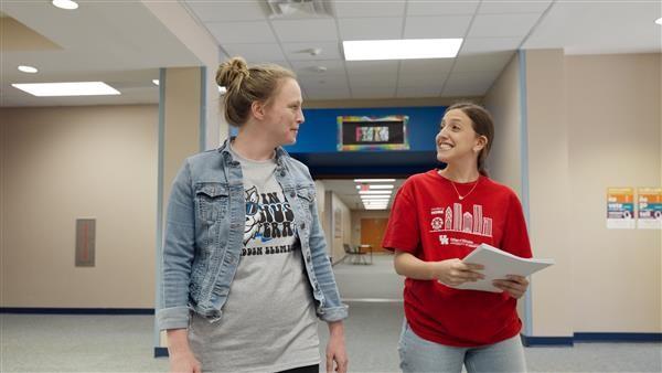 Two teachers walking and discussing